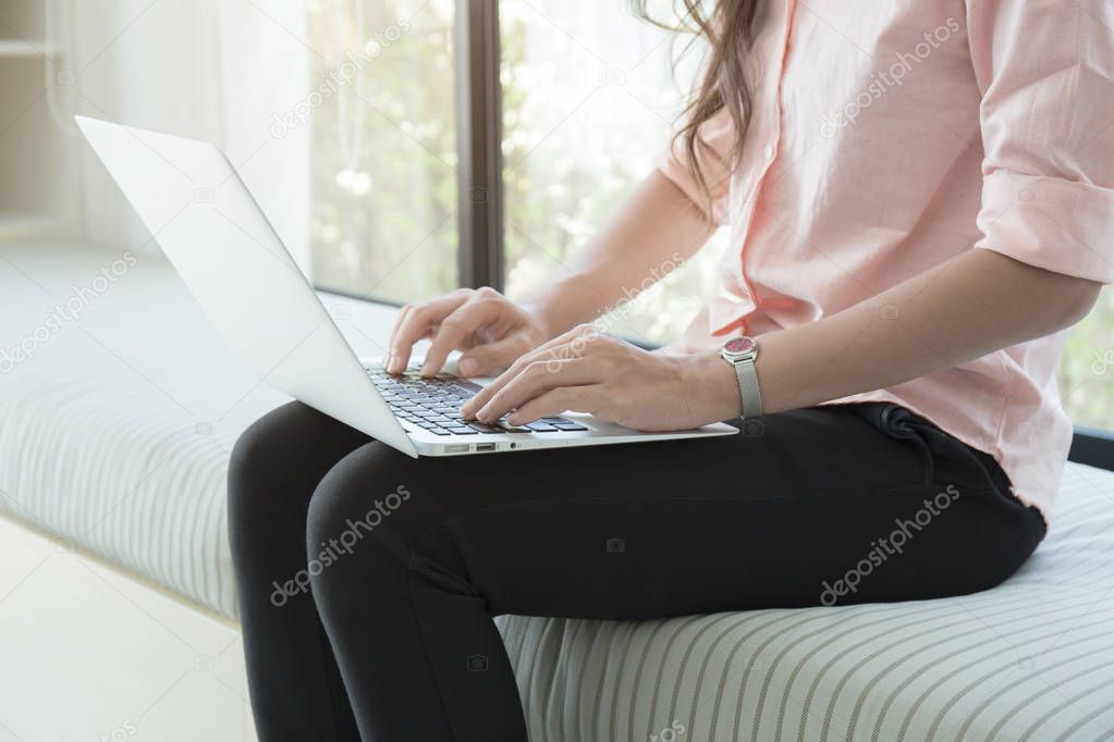 closeup hand asian business woman using laptop in home