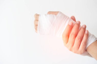 Women with painful wrist due to overuse or sport accidental on white background