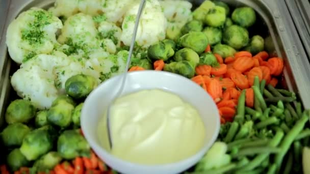 Boiled vegetables are in the dish with sauce — Stock Video