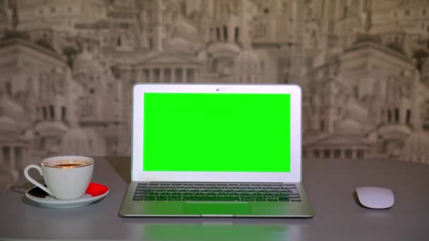 The laptop is on the table, a Cup of coffee. chromakey — Stock Video