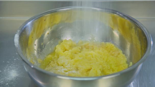 Pours flour into a metal bowl — Stock Video