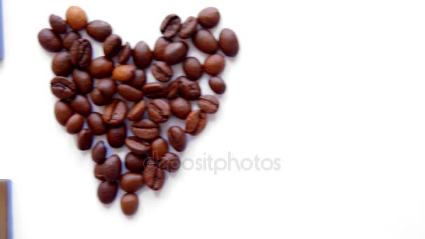 USB stick and heart from coffee beans on white background — Stock Video