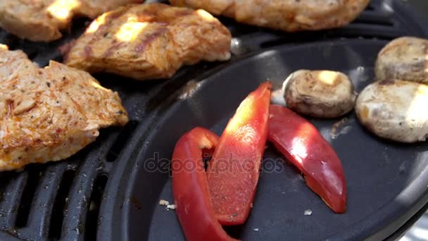 Meat, pepper, mushrooms and sausages on the BBQ — Stock Video