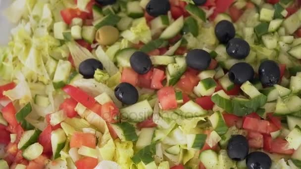 Buffet cold starters and salads are on the plates — Stock Video