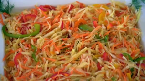 Sauerkraut with carrot is on the plate — Stock Footage Sauerkraut with carrot is on the plate Stock Video