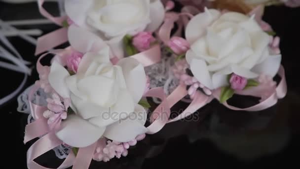 Wedding bouquet and rings on a black background — Stock Video