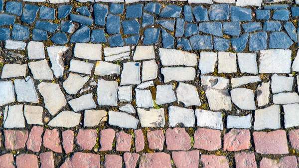Arka plan kaldırım taşlarından oluşan bir mozaik — Stok fotoğraf