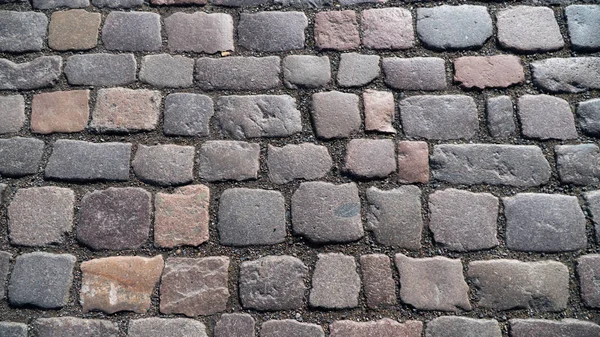 De achtergrond is een mozaïek van plakstenen — Stockfoto