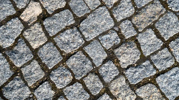 Hintergrund ist ein Mosaik aus Pflastersteinen — Stockfoto