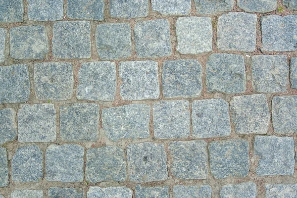 Old aged granite paving stones