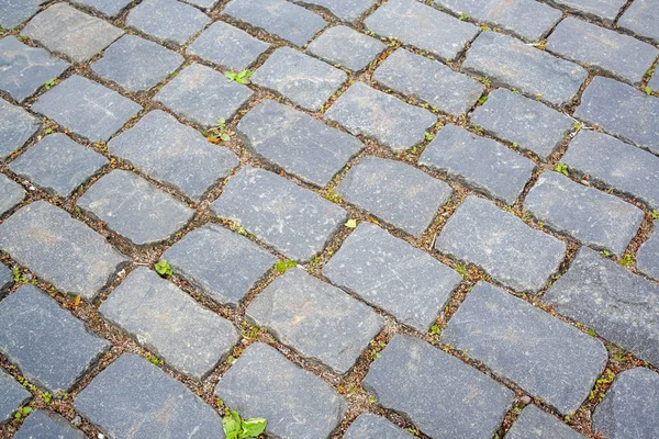 Antiguas piedras de granito envejecido pavimentación —  Fotos de Stock