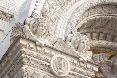 Two angels with wings on exterior of nicholas the wonderworker cathedral church. Architecture of unesco, orthodox sculptures clipart