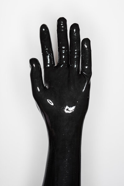 gesture of a hand wearing a black latex glove : open hand 