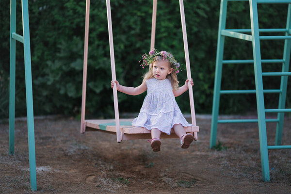 Girl eating candy and holding a flower