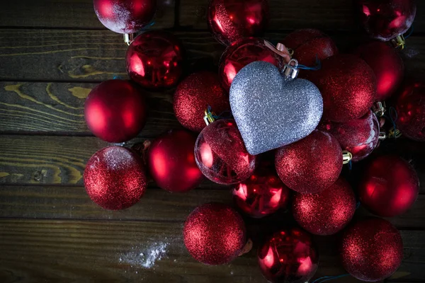 Red Christmas balls, Christmas ornaments, silver heart — Stock Photo, Image