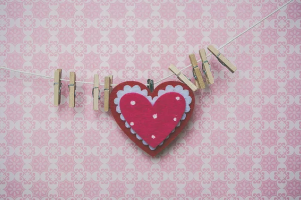 Many small pegs on a pink background — Stock Photo, Image