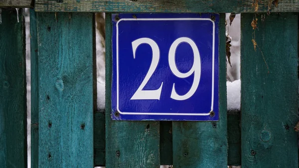 House number on wooden fence, house numbering