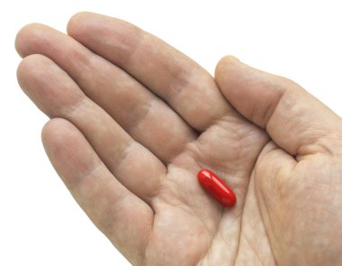 Avuç içinde kırmızı hapı