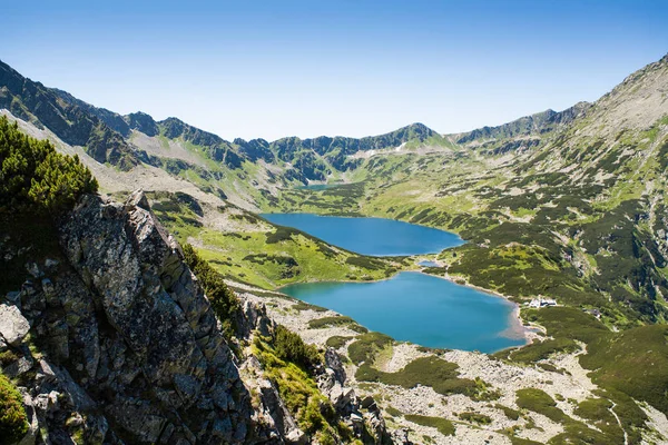 Tatras mountains, Valley of five ponds. View on mountains and tw