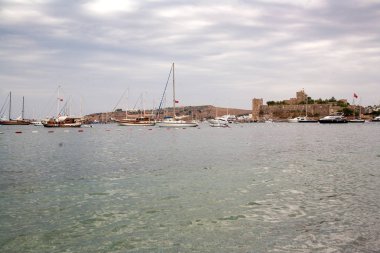 BODRUM, TURKEY - SEPTEMBER 20, 2016 ; The old fortified castle. Coast and harbor with boats,View of the port Bodrum Kale, castle.