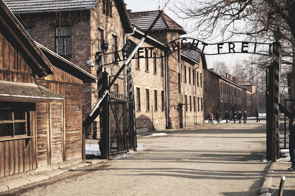 AUSCHWITZ, POLAND - JANUARY 28, 2018 ; Museum Auschwitz - Holocaust Memorial Museum. Anniversary Concentration Camp Liberation. The main gate of the camp with the inscription work makes you free.