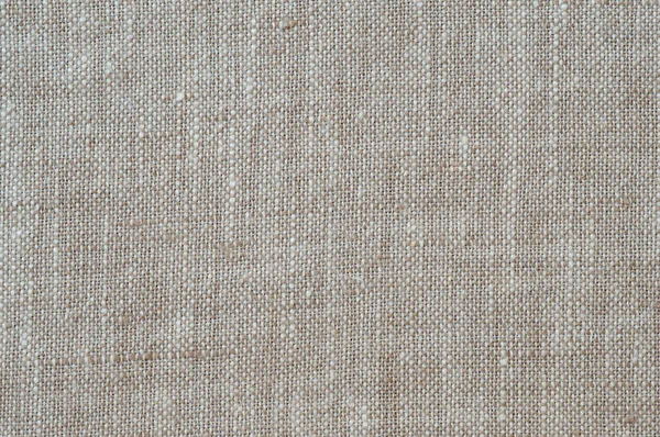Текстурированная льняная ткань в качестве фона — стоковое фото