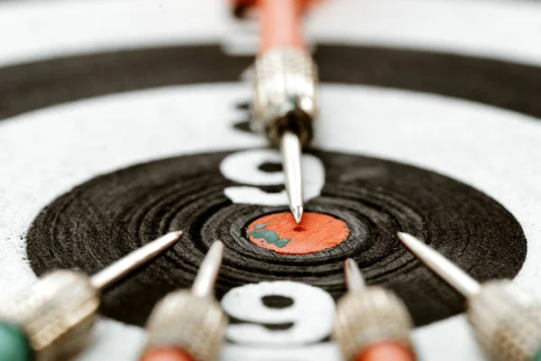 Close-up dart arrow point to target centre dartboard. business t — Stock Photo, Image