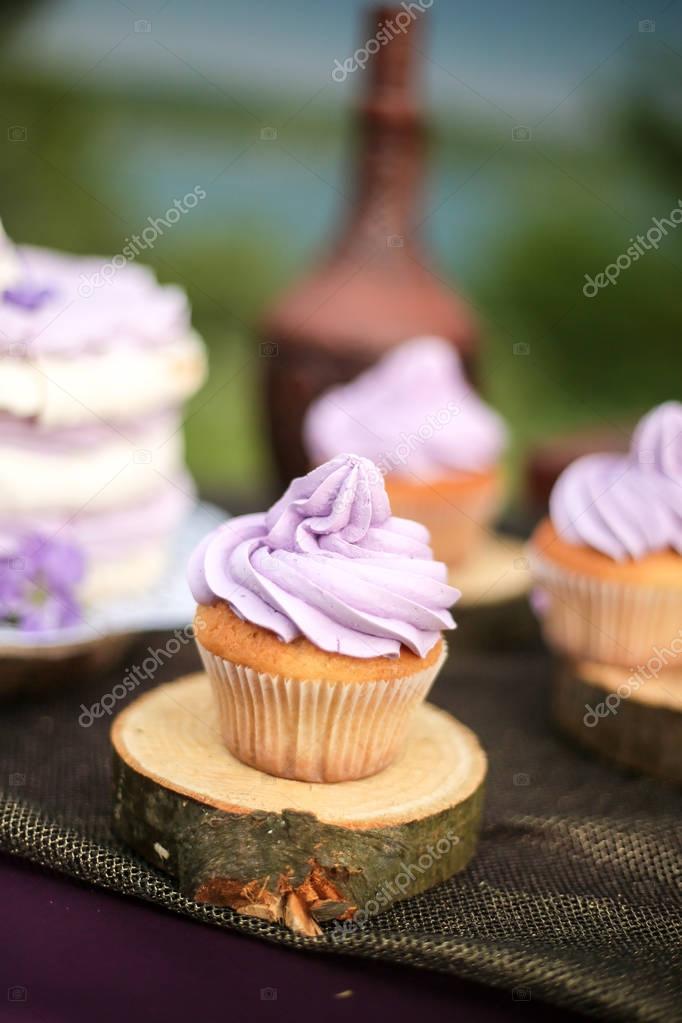 Tasty Purple Wedding Cake With Cupcakes Stock Photo Redkrysa