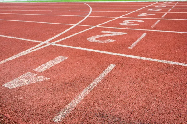 Correr textura de pista con números de carril — Foto de Stock