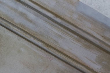 Kirli mavi ve paslı kahverengi renkler ve hareket hissi ile diyagonal desen ile soyut arka plan dokusu