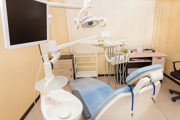 Dental chair with dentistry equipment. Modern dental practice.