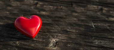 Parlak kırmızı taştan kalp, ahşap zemin üzerinde, güneş doğarken, aşk için ışık konsepti, 3 boyutlu illüstrasyon.