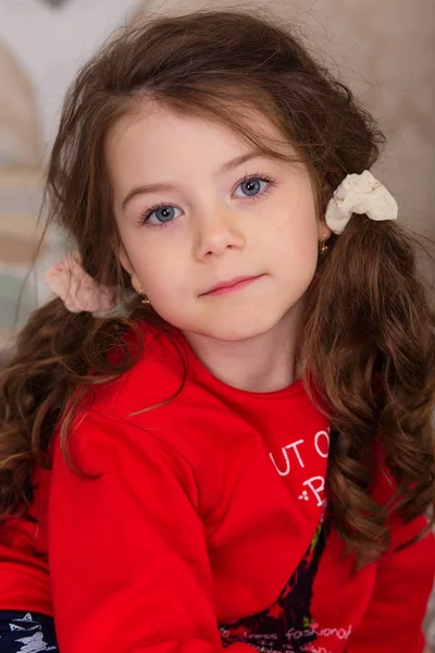 Sweet girl in pajamas getting ready for bed