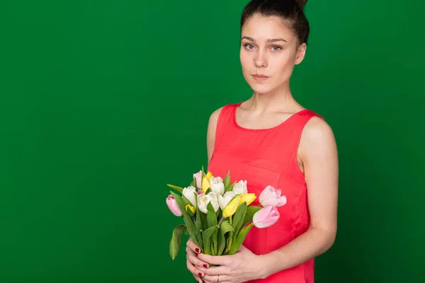 stock image Beautiful girl with a bouquet of tulips 