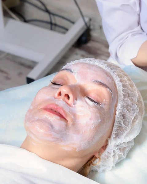 Beautician prepares face girls cream anesthetic Stock Image