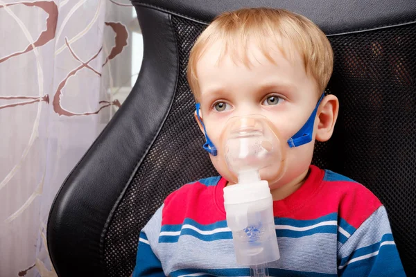 Boy making inhalation with a nebulizer Stock Picture