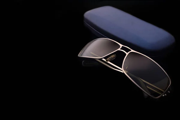 Sunglasses with case on black background Stock Picture