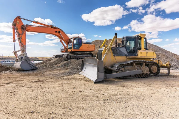 Excavator on the road construction works. Machinery needed for construction