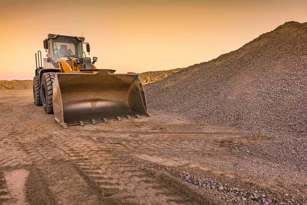 Excavator on the road construction works. Machinery needed for construction