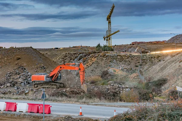 Excavator on the road construction works. Machinery needed for construction