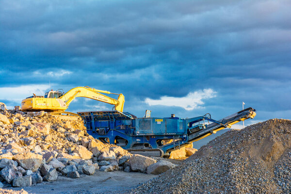 Outdoor industrial activity, mining with heavy machinery