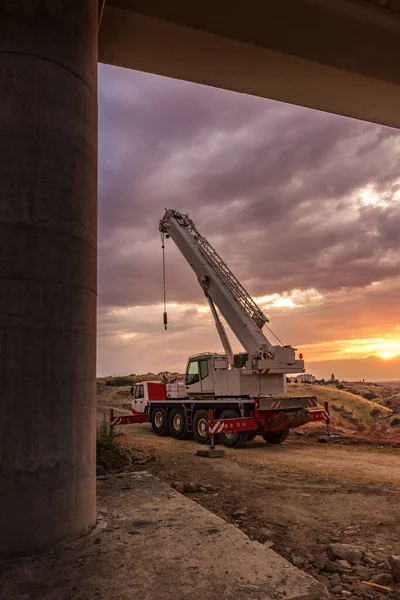 Mobile crane truck in the construction of a bridge