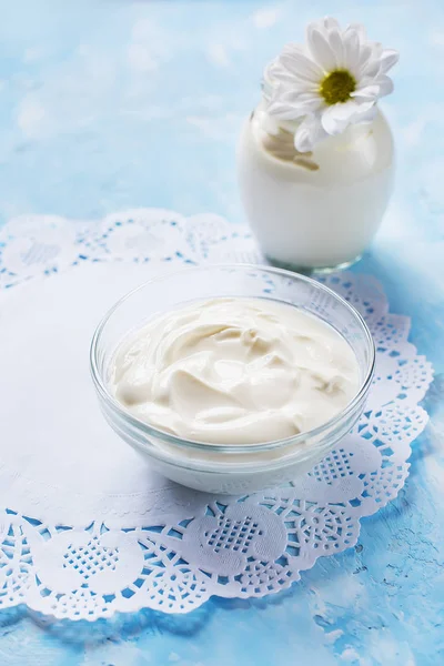Homemade yogurt on a gentle blue background. Healthy healthy food.