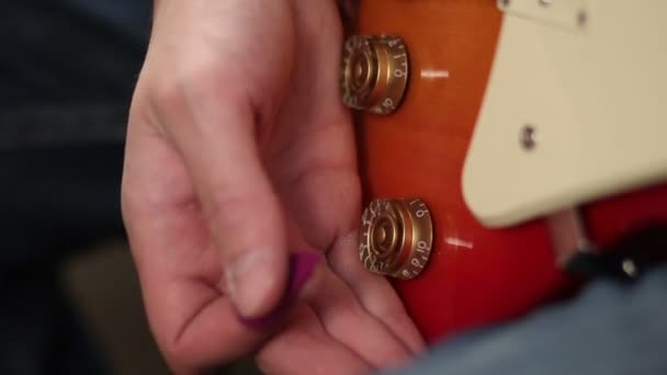 Tone knobs and volume of electric guitar — Stock Video
