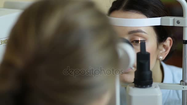 Eye examination at slit lamp in oculist office — Stock Video