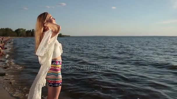 Girl takes deep breath enjoying fresh air on beach — Stock Video