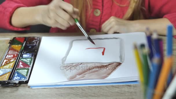 Girl painting with paintbrush and colorful paints — Stock Video