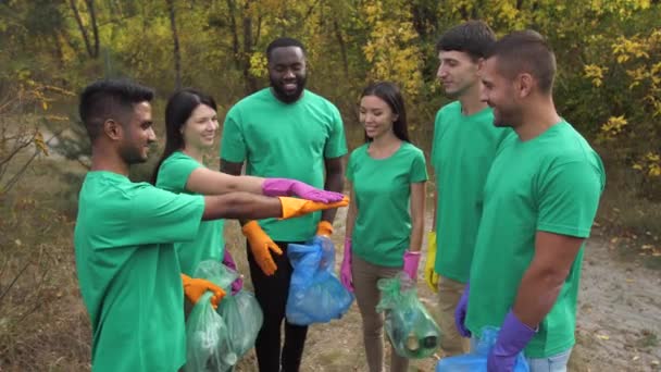 Multiracial volunteers rejoicing at work done — Stock Video