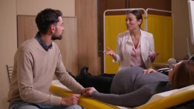 Obstetrician talking about course of pregnancy