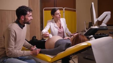 Future parents during ultrasound examination